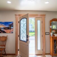 Thumbnail of http://Open%20front%20door%20with%20rug%20in%20front.