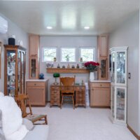 Thumbnail of http://Family%20room%20with%20built-in%20cabinets%20and%20a%20desk.
