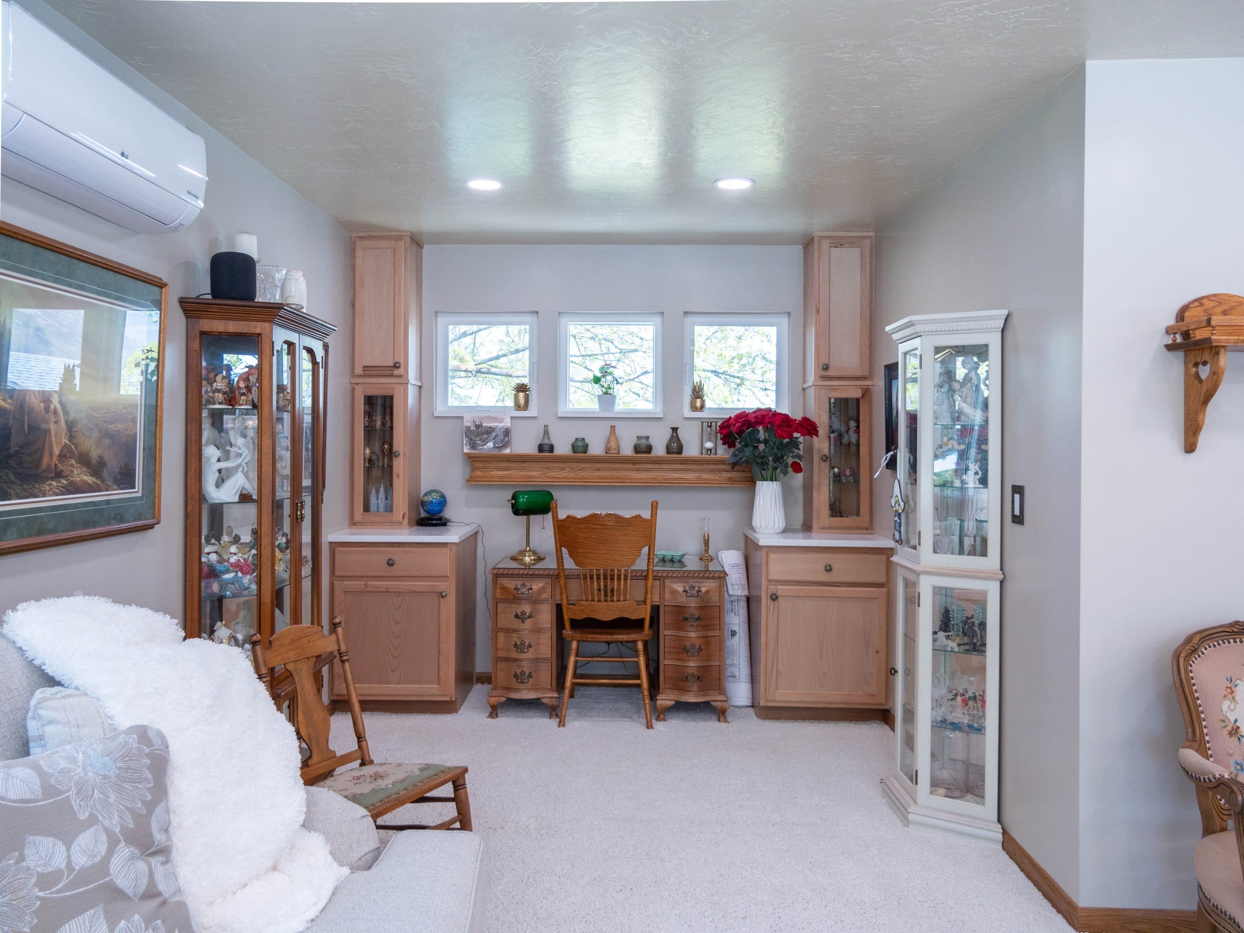 Family room with built-in cabinets and a desk.