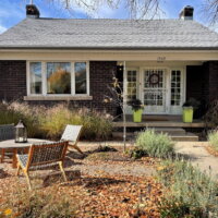 Thumbnail of http://Front%20exterior%20of%20a%20bungalow%20home%20with%20brick%20and%20a%20covered%20front%20porch.