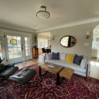 Thumbnail of http://Renovated%20living%20room%20and%20entry%20area.%20The%20living%20room%20includes%20two%20arched%20openings%20with%20access%20to%20the%20dining%20room%20and%20kitchen.%20Between%20the%20openings%20is%20the%20couch.