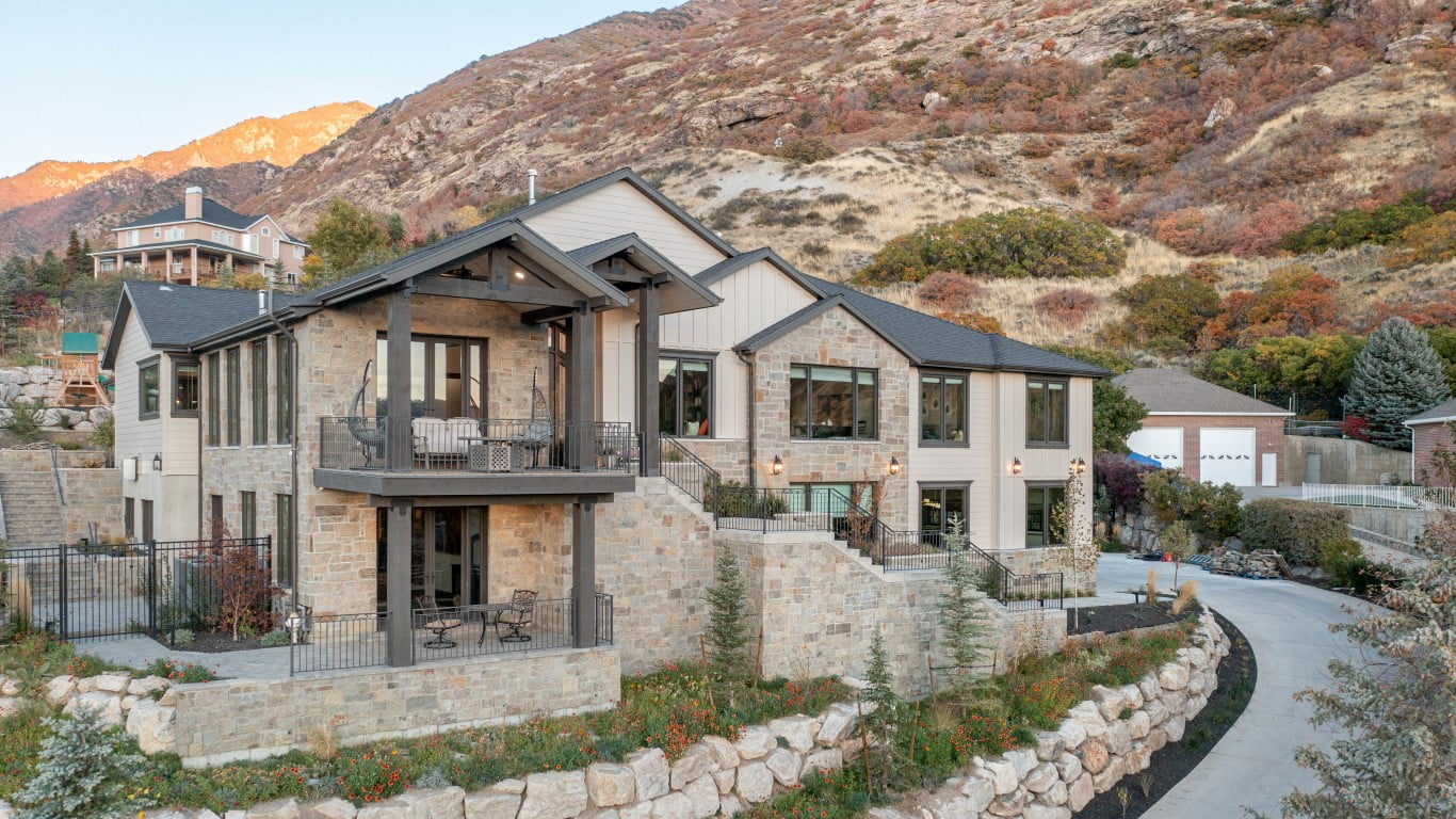 Custom large home front exterior on the side of a mountain.
