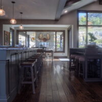 Thumbnail of http://Kitchen%20island%20with%20stools%20looking%20to%20the%20dining%20room.