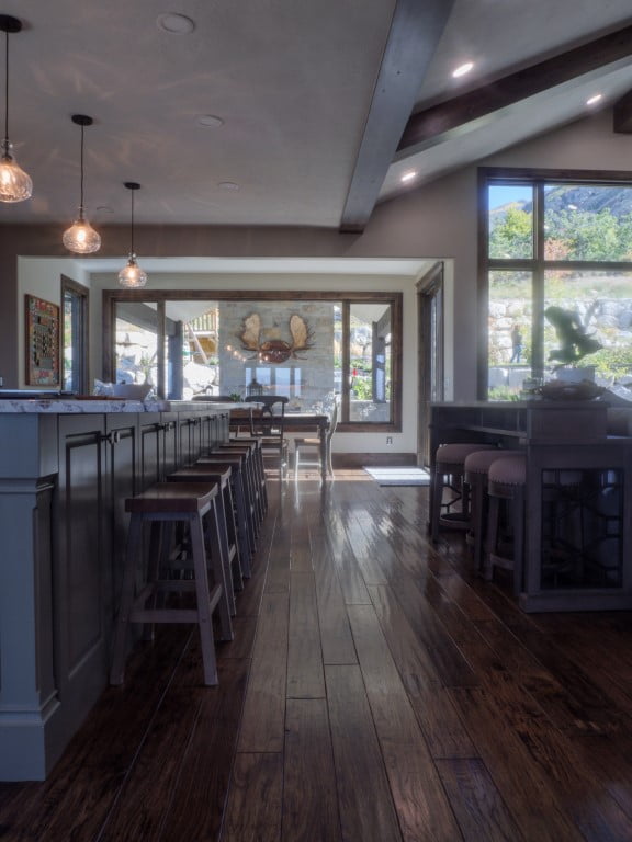 Kitchen island with stools looking to the dining room.