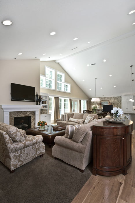 Great room with high ceilings, natural light, fireplace, and modern traditional style | Renovation Design Group