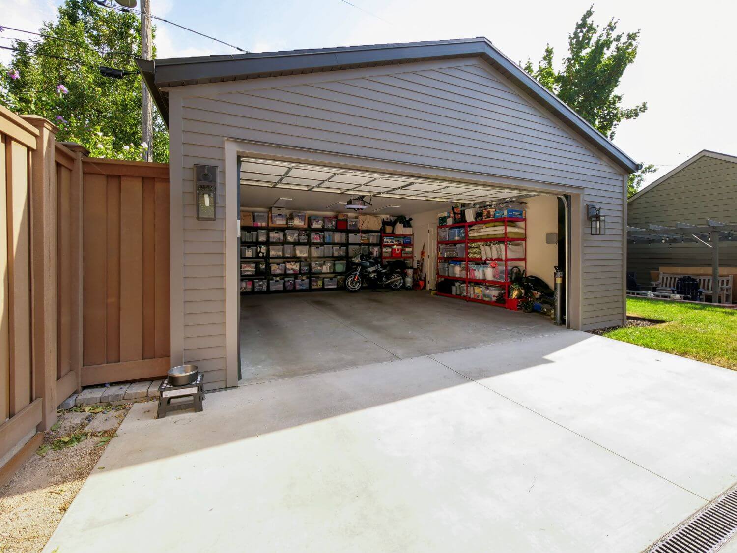 Exterior of two-car garage with door open.
