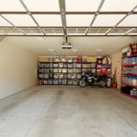 Thumbnail of http://Two-car%20garage%20with%20door%20open.