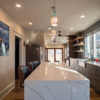 Thumbnail of http://Kitchen%20renovation%20with%20a%20long%20island%20in%20the%20center%20looking%20to%20the%20back%20door.