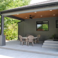 Thumbnail of http://Covered%20patio%20with%20stairs%20to%20the%20kitchen%20door%20and%20a%20ceiling%20fan%20with%20a%20table%20and%20chairs%20underneath.