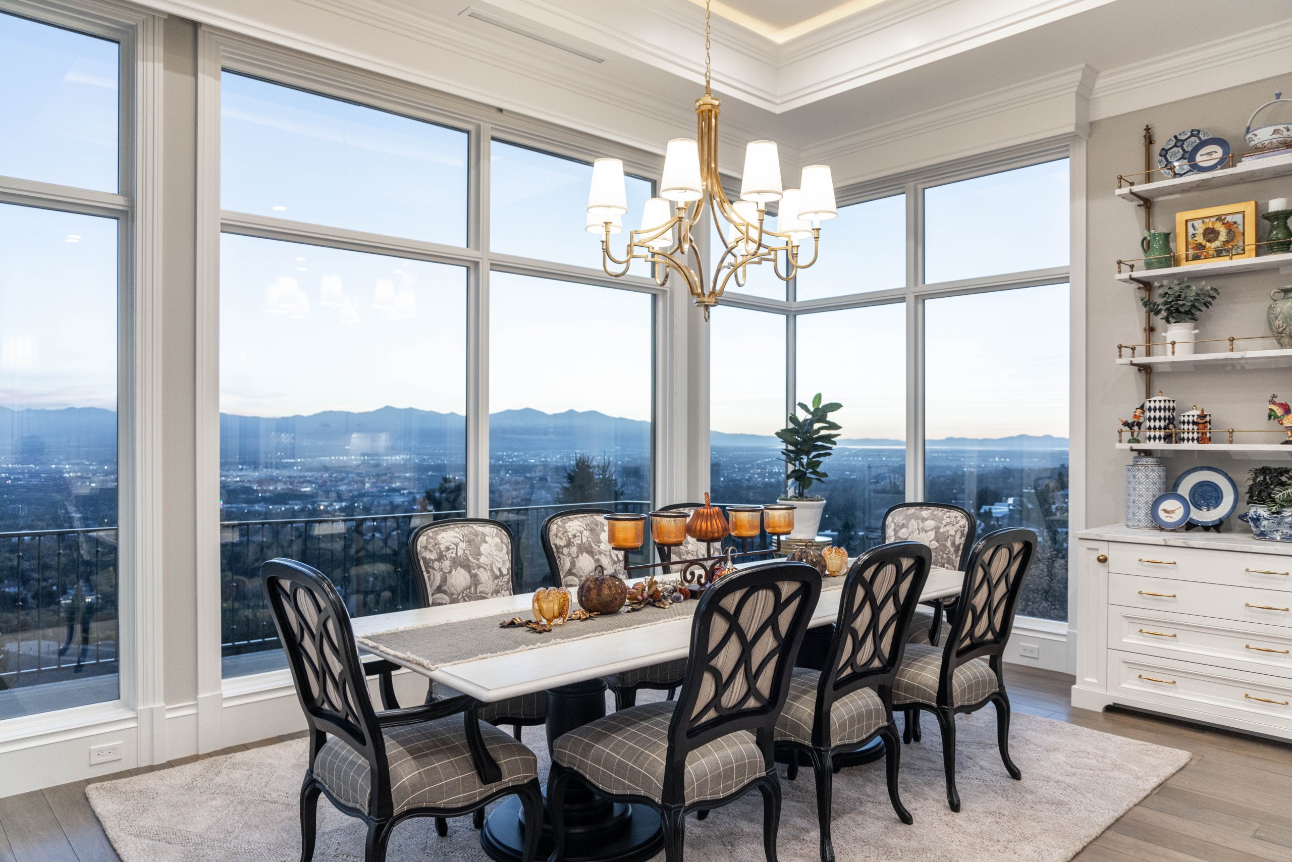 Large dining room table with windows overlooking the valley.
