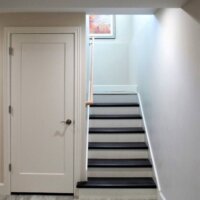 Thumbnail of http://Hallway%20with%20stairs%20on%20the%20right%20and%20a%20door%20on%20the%20left.