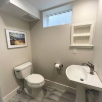 Thumbnail of http://Small%20basement%20bathroom%20with%20a%20sink%20and%20toilet.