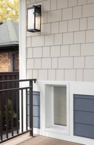 Exterior of dog door next to a railing on the deck. Dog-friendly home design ideas.