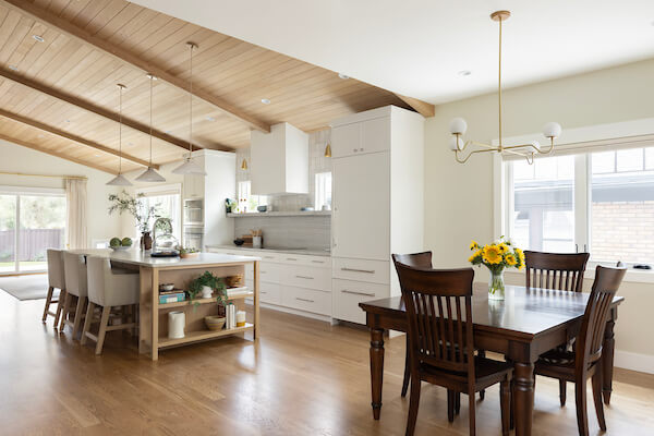 Open concept great room looking from the dining room through to the kitchen.