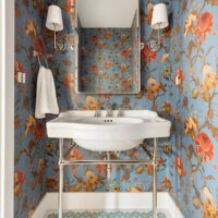 Thumbnail of http://Powder%20bathroom%20vanity.%20The%20console%20style%20sink%20is%20centered%20on%20the%20wall%20with%20a%20mirror%20and%20sconces%20above.%20On%20the%20left%20is%20a%20towel%20hook.%20The%20spaces%20features%20an%20elegant%20floral%20wallpaper%20and%20small%20hexagon%20tiles%20on%20the%20floor.