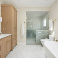 Thumbnail of http://Primary%20bathroom%20with%20the%20sink%20and%20cabinetry%20on%20the%20left,%20shower%20straight%20ahead,%20and%20the%20toilet%20and%20tub%20on%20the%20right.