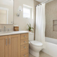 Thumbnail of http://Basement%20bathroom%20with%20a%20simple%20design.%20Includes%20a%20vanity%20with%20storage,%20toilet,%20and%20combined%20shower%20and%20tub.