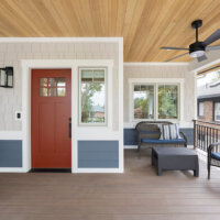 Thumbnail of http://Covered%20front%20porch%20with%20a%20small%20sitting%20area%20to%20the%20right%20of%20the%20front%20door.