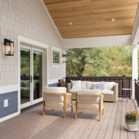 Thumbnail of http://Large,%20covered%20deck%20in%20the%20backyard.%20The%20space%20includes%20two%20doors%20with%20one%20being%20from%20the%20primary%20bedroom%20and%20the%20other%20from%20the%20living%20room,%20outdoor%20furniture,%20and%20a%20vaulted%20ceiling.