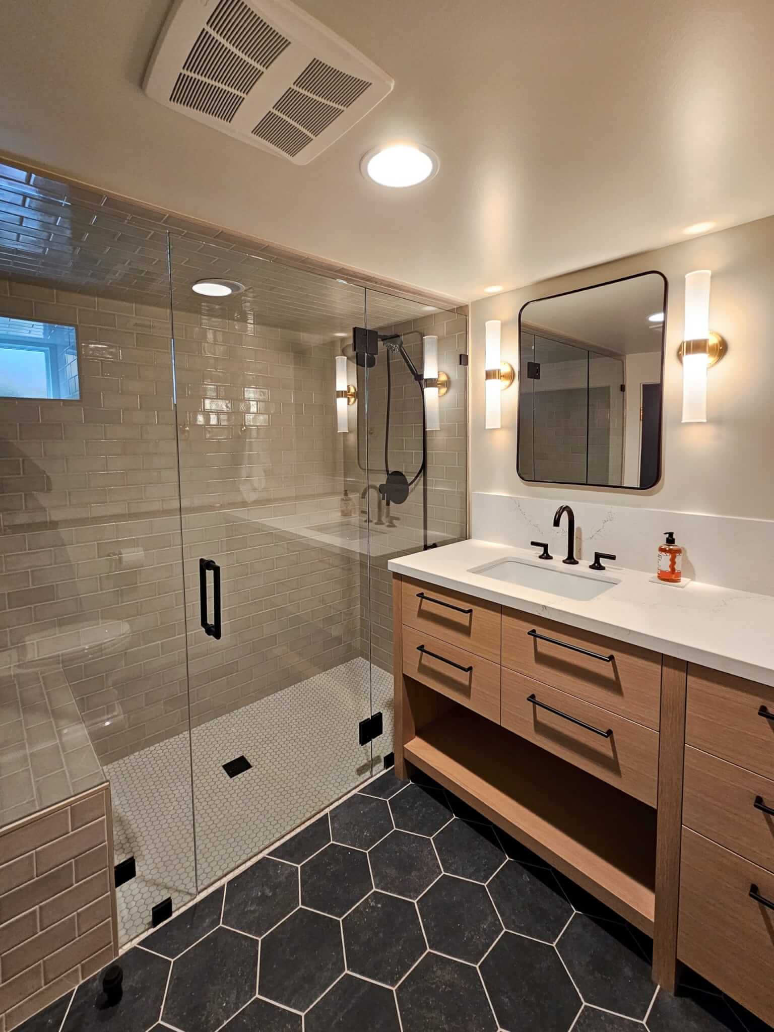 Modern bathroom vanity and shower.